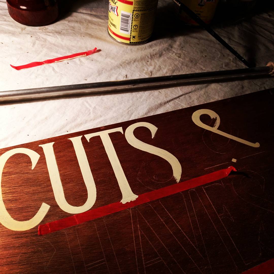 One Shot lettering enamel starts to go on. Fruit and Vege bagging tape makes a great masking strip